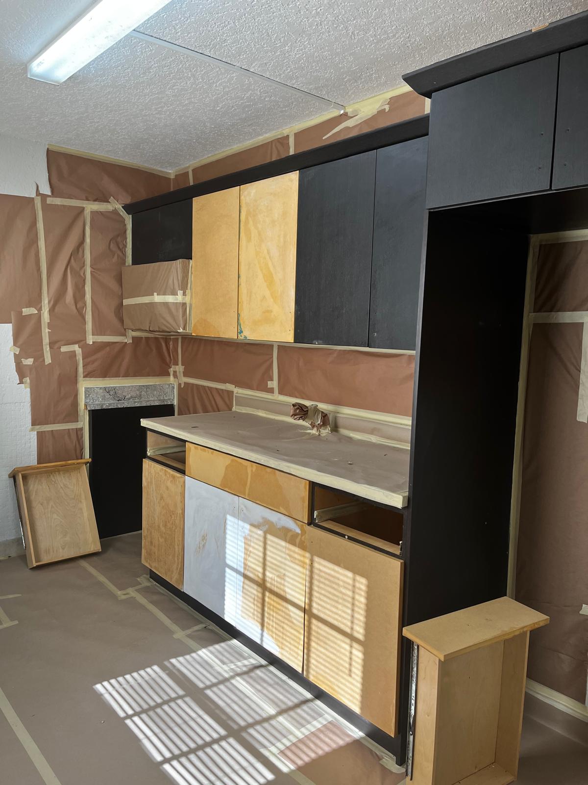 Kitchen cabinets masked and prepped mid-project